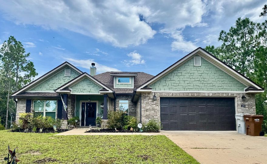 This stunning water view home is located in Gulf Breeze, FL. Location is desirable and is tucked between Navarre and Pensacola Beaches which are just minutes away. There is a large fenced in private backyard that is surrounded by trees . There is a  large shed for optimal storage. There is a covered lanai with a patio out back which is perfect for watching birds, butterflies and bunnies which are plentiful.  The family room has a large floor to ceiling wood burning fireplace that is perfect for those chilly winter evenings. No need to worry about power outages with this solar powered home with a backup Generac.