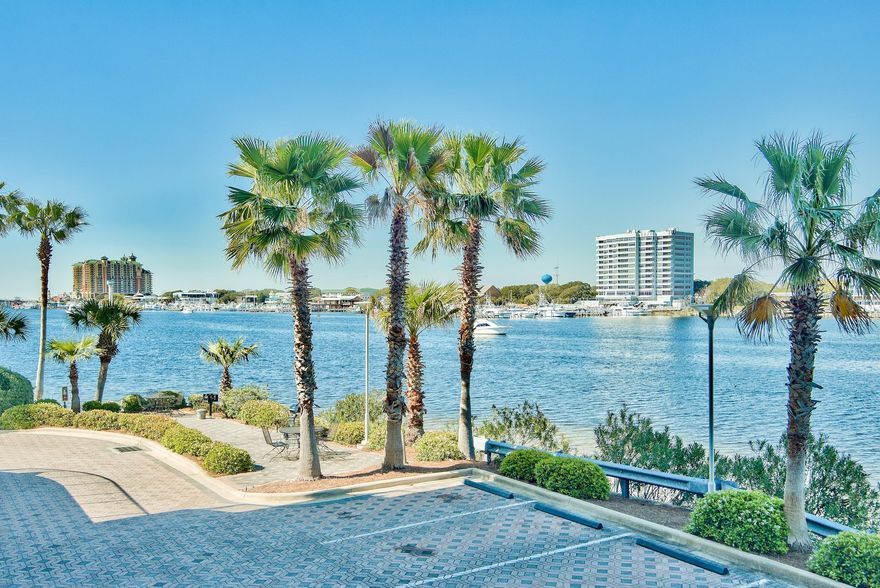 New and Improved Price! Your private beach home awaits you in the low-density, gated Harbor Lights Condominium, with remarkable sunset views from your terrace overlooking Destin Harbor. This unit conveys with Storage #35. Featuring 10-foot ceilings, an open floor plan, a wall of glass sliders, & crown molding in the living area. Low maintenance tile flows through the entry, living, kitchen, & bathrooms. Granite countertops, pantry, custom tile backsplash, stainless steel appliances & a large breakfast bar in the kitchen. The harbor front master bedroom's large walk-in closet, his and her vanities and walk-in shower are sure to please. The 2nd bedroom overlooks the pool and canal. Harbor Lights boasts excellent community amenities, with a common area, paddle board storage, owner's only beac