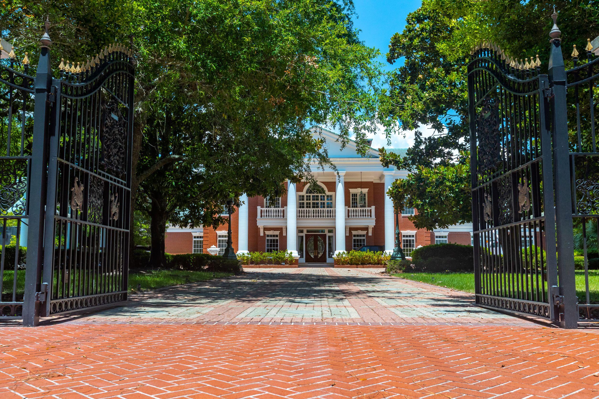 One of Destin's finest estates, meticulously upgraded by its current owner! The home has a gated entry with a private pool and dock.  It is complete with a 3 car garage and a spacious carport.  The home sits on almost 2 acres with a private tennis court and a brick paver driveway.