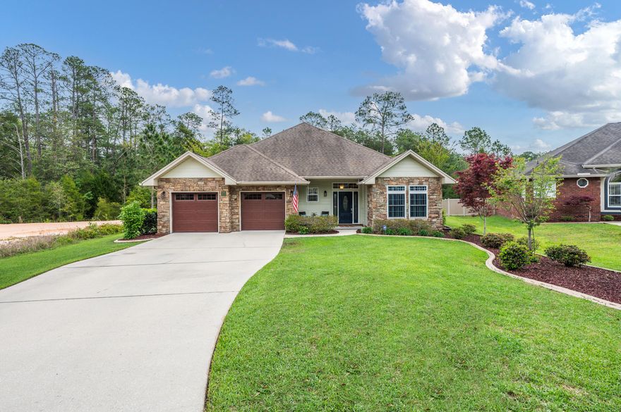 Four bedroom with custom upgraded and your dream kitchen.From the curb alone this home will have you excited. A long oversized driveway sits amidst custom landscaping, leading you to the beautiful stone and hardie board front of the home. Inside, no expense has been spared, with hardwood floors in common areas, tile in the kitchen and baths, and lush carpet in the bedrooms. Crown molding, chair rails and colonial standard interior doors all add extra luxury details. In the front right wing you have two full bedrooms and a full hall bath with tub/shower combo and double vanity. In the back right wing you have a full bedroom and a flex room with a full hall bath and a walk in shower that sit on one side of this split floor plan