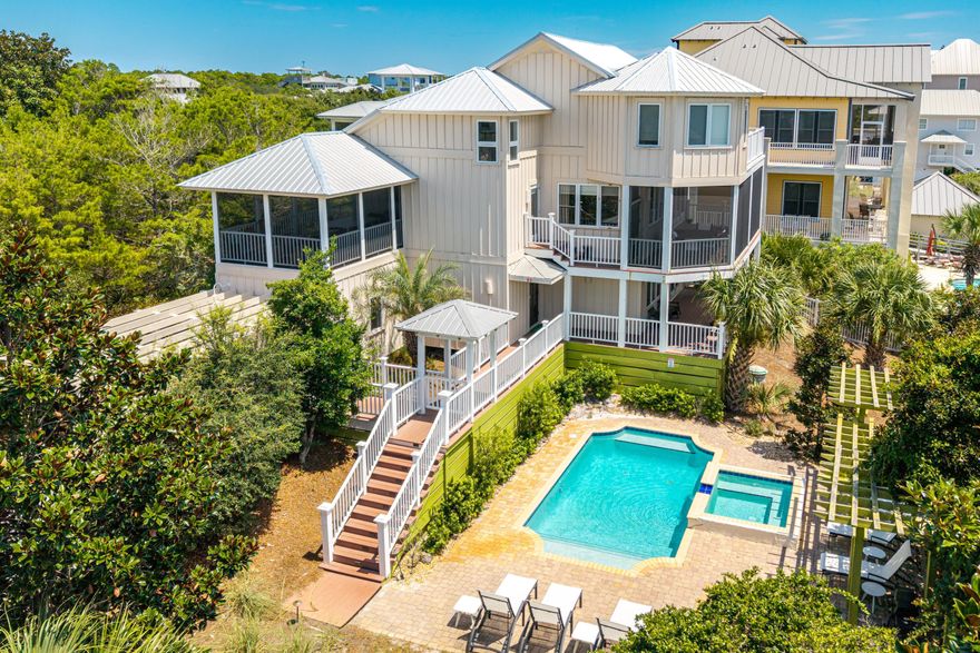 Discover the perfect blend of luxury living and rental income potential in this custom-designed beach home, offering unmatched versatility as a vacation rental, second home, or primary residence. Enjoy exclusive access to the private Gulf Pines beach,  with over 1,365 linear feet, providing a serene and secluded coastal experience just steps away. With over 3000 sq ft of heated/cooled living space and 500+ sq ft of outdoor porches and decks, this property is designed to accommodate large families or groups with ease. The ground-floor suite is ideal for short-term rental guests or multi-family use, featuring two bedrooms, two baths, a sitting room, office space, and a kitchenette. 
The second level showcases an open-concept great room with stunning Gulf views, wide board wood floors, a cozy fireplace, and a gourmet kitchen equipped with solid surface countertops and stainless steel appliances. A guest bedroom and bath complete this level. 
The top level is a private master retreat, boasting vaulted ceilings, a sitting area/study, a spa-style bath with a soaking tub and marble tile, and a walk-in closet with built-ins.

Premium features for renters and owners alike:
*   9' ceilings, solid wood doors, and wide wood flooring
*   High-end windows and doors, plus a Bose surround sound system indoors and out
*   Spacious screened porches and sun decks on every level
*   Oversized lot for added privacy and space
*   Exclusive access to the private Gulf Trace beach, enhancing the coastal lifestyle

Whether you're seeking strong ROI through rental income or aiming to embrace coastal living at its finest, this home delivers exceptional value in a high-demand beachside location. 

Call today to schedule your private appointment and experience the luxury of Gulf Pines.