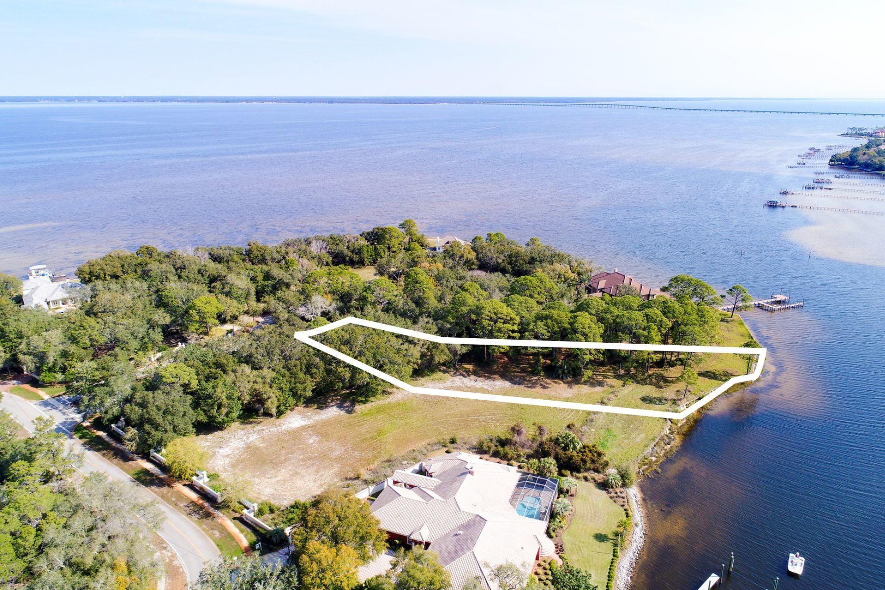 The Estates at Indian Pointe is a gated enclave of Bay and Bayou front home sites in Destin, Florida. This .87 acre Bayou front lot features deep water access, essential for the avid boater. Tucked away at the very east end of Indian Trail, occupying what is perhaps the most remote waterfront location in Destin, this especially private piece of property is only an 11 minute drive from beach access with parking, as well as shopping, dining, seasonal entertainment, and chartered fishing excursions at Harborwalk Village on the Destin Harbor. The Estates at Indian Pointe is the pinnacle of luxury waterfront living for those who refuse to compromise the beach lifestyle in order to pursue their passion for boating.