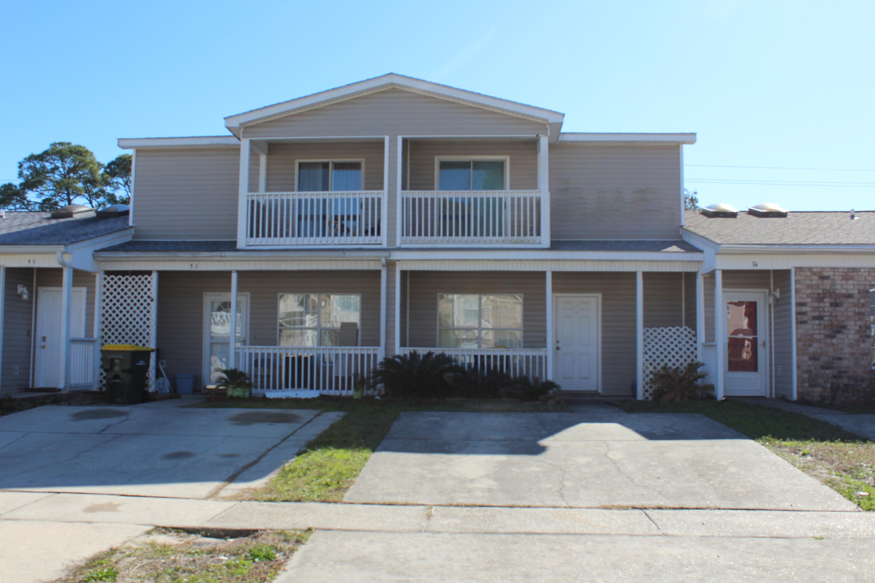 Investor Dream Property! No HOA! This home rents quickly, built in year 2000, roof placed (approximately 2 years), HVAC replaced (approximately 5-7 yrs), centrally located in Fort Walton Beach, FL, close to the beaches and military bases, and has great potential! The unit has 1350 sq feet and that includes 2 large bedrooms with private balconies! The primary bedroom has a large walk in closet! There is an open floor plan with the kitchen, dining, and living room on the main floor! The kitchen has a large peninsula that seats 4-5 and a counter height breakfast bar! There is one full bath upstairs and a half bath downstairs! There is also a separate laundry room and pantry! There is 20 inch tile on the diagonal on the first floor! The upstairs has carpet! The back yard is fenced and private! There is also two Covered patios! This home has awesome outdoor living space with two balconies and two covered patios! This home is conveniently located to restaurants, downtown entertainment, schools, and churches! There is plenty of room to park several vehicles! There is NO HOA!! Put a fresh coat of paint, replace the carpet, and update some light fixtures and appliances and you will have a great home or investment property! Buyer to verify all dimensions and information!