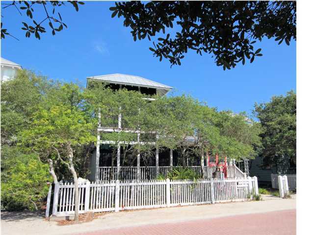 Sisters Three-by-the Sea, the 3 bedroom, 3 full bath main cottage, is a traditional Florida beach cottage that will bring back favorite memories of your family's summer vacations. Located just three lots in from 30A, you can stroll to the beach in seconds. The spacious wrap-around screened porch is nestled behind a thick grove of oak trees. Play board games on the outdoor table, relax on the comfortable wicker porch furniture listening to grandparents reminisce about how they spent their childhood vacations, or climb up to the shuttered tower with ocean views to read you favorite book and enjoy the sea breezes. Exterior Bahaman shutters provide shade from the heat of the Florida sun. French doors welcome you into the living area filled with light from the clerestory windows and sense of