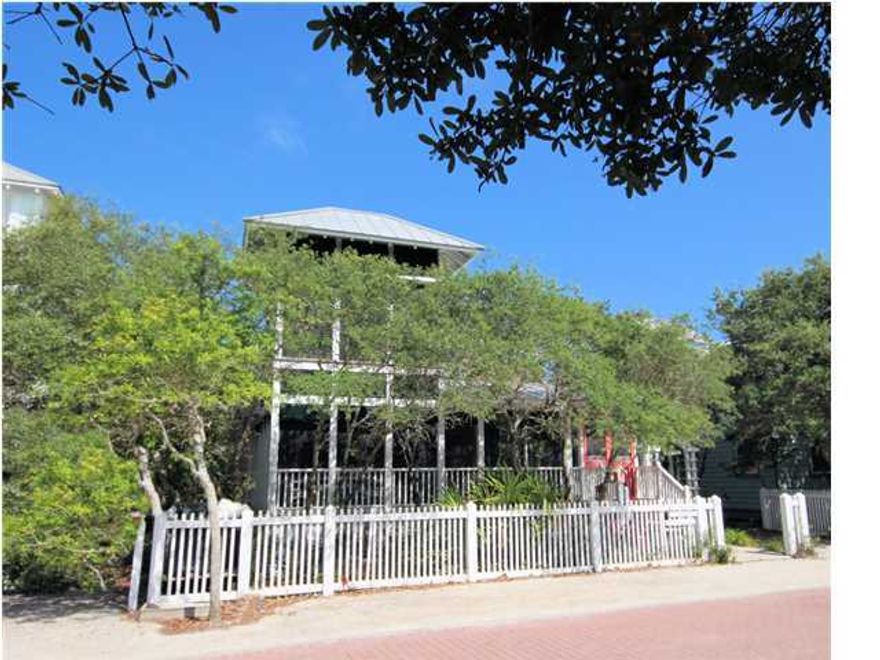 Sisters Three-by-the Sea, the 3 bedroom, 3 full bath main cottage, is a traditional Florida beach cottage that will bring back favorite memories of your family's summer vacations. Located just three lots in from 30A, you can stroll to the beach in seconds. The spacious wrap-around screened porch is nestled behind a thick grove of oak trees. Play board games on the outdoor table, relax on the comfortable wicker porch furniture listening to grandparents reminisce about how they spent their childhood vacations, or climb up to the shuttered tower with ocean views to read you favorite book and enjoy the sea breezes. Exterior Bahaman shutters provide shade from the heat of the Florida sun. French doors welcome you into the living area filled with light from the clerestory windows and sense of