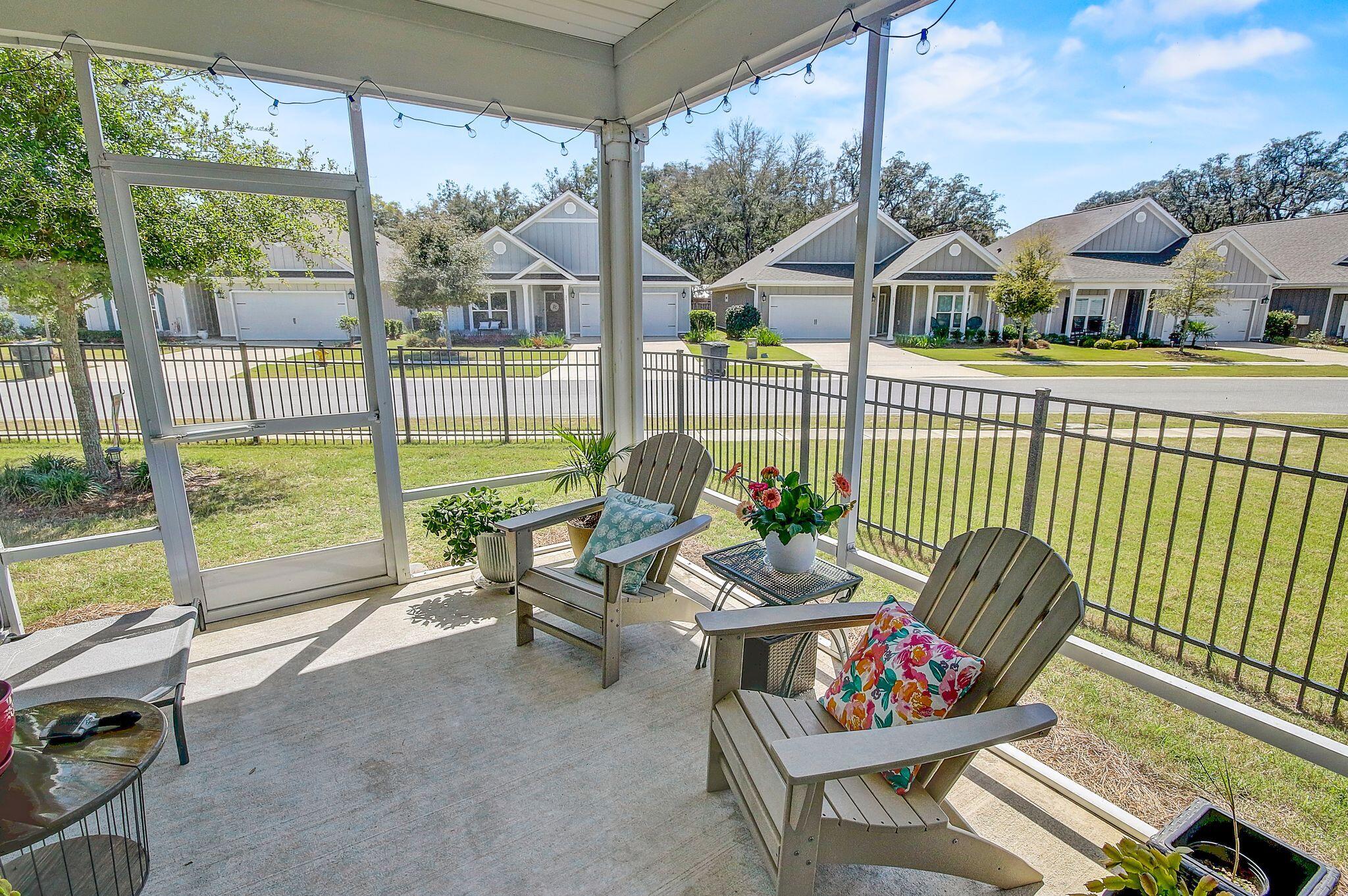 CAPTIVATING HOME IN GATED FIREFLY AT HAMMOCK BAY IS PERFECTLY PRICED! This 3/2, 2 car garage home has an abundance of sunlight and two wonderful outdoor areas for relaxing! Curb appeal abounds with a spacious front porch, covered entry and wide foyer for welcoming your guests. The open floor plan provides a wonderful flow in this home, and yet has a designated living room with a bank of windows. Nine foot ceilings and vinyl plank floors lend an elegant vibe to the home. Your kitchen has painted cabinetry, stainless appliances and walk-in corner pantry .The inviting primary suite is located at the rear of the home and enjoys a luxurious bathroom with spacious shower and walk-in closet. Primary closet connects directly to the laundry providing ease of access. Two generously sized guest rooms, an adorable guest bath, drop zone area, and a whole house surge protector complete this home. In Florida, you'll be spending a lot of time outdoors and this home has a picture-perfect spot for morning coffee and afternoon leisure. The screened lanai is absolutely delightful and almost always enjoys a soft breeze! Firefly at Hammock Bay is gated, enjoys its own clubhouse, swimming pool, and pickleball courts all just down the street. The quarterly HOA fee includes basic cable and lawn care package. Firefly residents have use all of Hammock Bay's extensive amenities, including: 24/7 8,000 SF fitness facility; owners' club with theatre, caterer's kitchen, and party space; three swimming pools, tennis, basketball, pickle ball, playground, fishing pier, 60 acre sports complex with many sports and recreation possibilities, and really too many to list! Hammock Bay is building two additional clubhouses, one of which is located on Choctawhatchee Bay for enjoying spectacular sunsets. Town Center will soon have "Props Brewery" as a wonderful gathering spot for the neighborhood. Come see YOUR new home at 131 Dusky Way! Buyer to verify all square footage and information important to them.