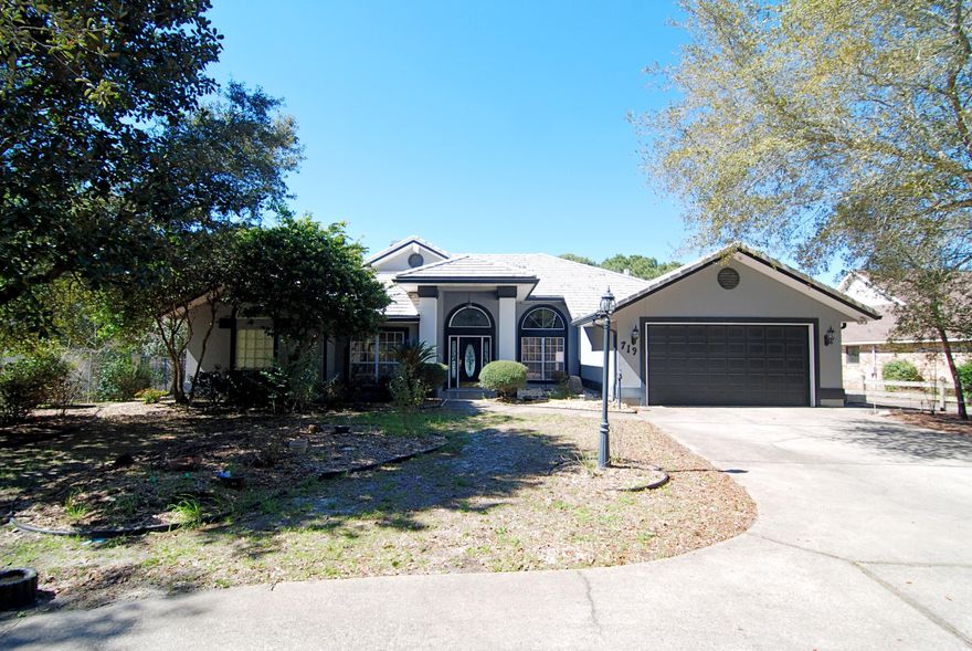 Live in the heart of Destin with this wonderful home on Joe's Bayou. This gorgeous lot is private and secluded nestled on 90 feet of deep water. Has tile floors in the foyer, kitchen and Florida room, hardwood floors in the dining room with carpet in the living area and bedrooms. Large sliding glass doors fully open and recess into the walls lead from the living area to the large Florida room and wonderful pool area. There are sliding glass doors also in the master bedroom and breakfast area. There is a bonus workshop area for the mister of the house right off of the two car garage.A perfect spot for the water-sportsman. See you on the water!!!