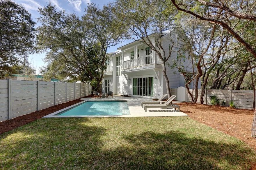 This custom cottage is a mastery of architecture and innovative design fashioned with clarity and intention. It is progressive and minimalistic, yet encompasses the essence of luxury living. 134 Blue Lake is a collaborative effort of design and construction; designed by Stephen Bricker and built by Onno Horn of Domicile. The final touches were tastefully designed by Domicile and Holly Shipman. Nestled in the signature dancing oaks of Blue Mountain Beach, just a block away from the Gulf, this retreat is both perspicacious and purposeful.The comfortable and peaceful outdoor space boasts a salt water pool, outdoor shower and a roomy pool deck all tucked away behind a pickled-pine privacy fence. The cantilever balconies were purposefully placed to leave room on the lot for the indigenous landscaping and gravel walking paths to create a private retreat perfect for entertaining.
The 1st floor main living area features an open floor plan with beautiful 10" wide, white oak floors, raised and beamed cathedral ceilings, bull-nose corners, surround sound throughout and lots of large windows and transoms. One of the many extraordinary attributes to this cottage is the Euro-Wall sliding doors.  These are not only stunning, but allow for nearly seamless transition from the interior to the exterior of the home. 
The kitchen features all stainless steel appliances, a generous kitchen island with a breakfast bar topped with gorgeous lime stone counter tops. Custom cabinets and spacious farm-style sink make this kitchen a true pleasure to be in. There is a guest bedroom and full bath on the 1st floor. Euro sliding glass doors lead you to a pleasant patio. Clever use of transom windows is just another detail that lends to exceptional flow of this home. The master en suite and additional bedroom are both stylish and comfortable. Sliding pocket doors are used throughout, saving valuable space. The laundry room is spacious and has a separate exterior door. 
The 2nd floor consists of a split bedroom theme, an open office space, a media/game room with a loft, and a kitchenette with a wine refrigerator. Each room has a private balcony and a cathedral ceiling with reclaimed oak beams.
This cottage is strategically placed in Blue Mountain Beach which is characterized by both lavish Gulf front private residences, and simple Old-Florida cottages. It is one of 30A's most sought after communities; a paradise set on the highest elevation in the Gulf of Mexico. Monikered from the lush lupines that grow wild along the shores of one of 30A's coveted coastal dune lakes, Blue Mountain is truly the purveyor of the 30A lifestyle. 

