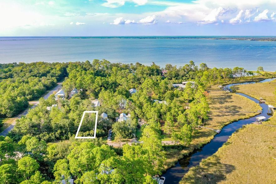 This lot is ready for your future primary home or beach house by the Bay. The relaxing area of Magnolia Beach in Point Washington is just a short drive to Grayton Beach, Watercolor, and Seaside. This very up-and-coming neighborhood has no HOA dues and is just minutes from 30A, but without the traffic. It's a very private feeling neighborhood that is starting to boom, so stop by today to scout this lot while it's still available.