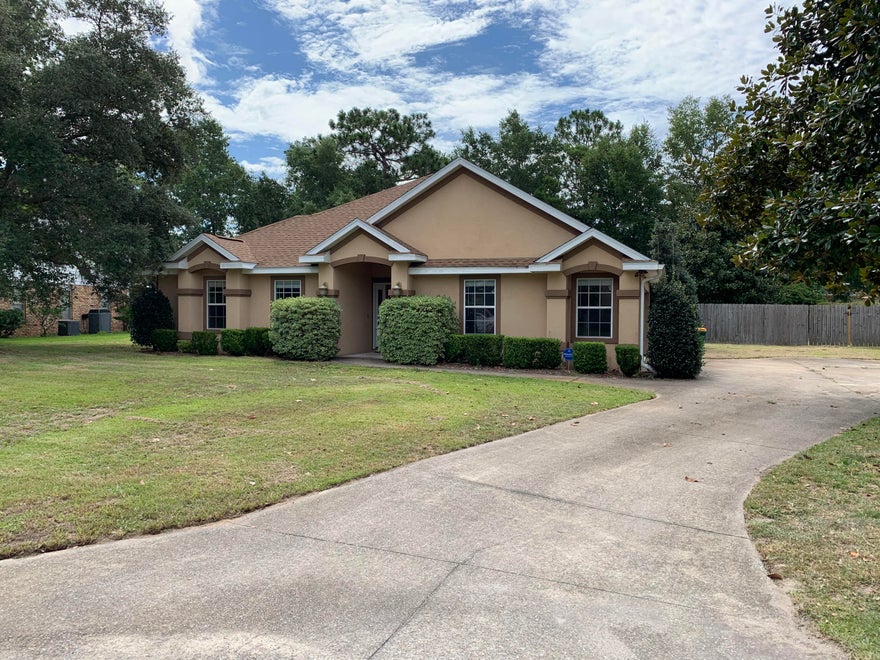 Super rare 4 bedroom, 2.5 bath home in the most desirable neighborhood, in the most desirable school district in the state of Florida! As you approach this Mediterranean Style home you will notice the extra large expanded driveway leading to the two car garage on the side of home. This lovely home has been updated to include energy efficient hot water heater and air conditioner, as well as ceramic tile throughout with attention to detail. House features split bedroom floor plan and high ceilings. Bose 7.1 surround sound system already in place. All updated lighting fixtures and ceiling fans throughout. Crown molding and built in plant shelves. In the kitchen you will find high-end stainless steel appliances surrounded by pecan cabinets for that nice added touch. A corner fireplace in your
