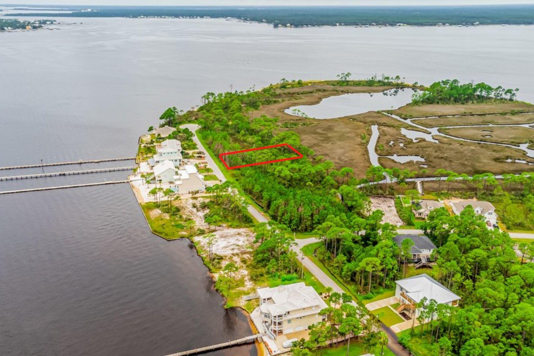 *Just voted on: Amenities coming in 2024 - park playground, dock extension, and a walkover to the beach!* Come build your dream home on this 0.42 acre lot, encompassed by Bay and Sound water views, located on beautiful Innerarity Point in the gated community of Innerarity Shores. Enjoy this quiet, no-outlet street, with natural landscaping surrounding the area. Located just 5 miles to Perdido Key and beaches. Other mentionable points of interest nearby: The gorgeous new Innerarity Point Park with water access, Galvez Landing public boat launch, and the world famous Hub Stacy's! Come and see the peacefulness and the well-kept secret of Innerarity Point and all it has to offer! See our full video tour on the MLS and YouTube.