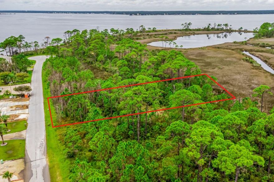 *BRING ANY & ALL OFFERS!!* A Wetland Assessment Study Report has been completed and is available in the MLS docs. Estimated permitting costs range from $10,000-$12,000, assuming a site plan acceptable to federal and state agencies. (Typically, detached structures such as pools, garages, or guest suites are not permitted, though a 10-foot yard adjacent to the residence can generally be allowed within the wetland area.) Come build your dream home on this beautiful 0.42-acre lot, surrounded by Bay and Sound views in the exclusive, gated community of Innerarity Island. Residents enjoy deeded water access, walking trails, a park and playground, a fishing area with dock extension, and basketball and pickleball courts. Nestled on a quiet, no-outlet street, this homesite offers peace, privacy, an d natural coastal beauty! Conveniently located just 5 miles from Perdido Key and its beaches, and minutes from Innerarity Point Park, Galvez Landing public boat launch, and the world-famous Hub Stacy's, this property offers the perfect balance of tranquility and accessibility. Discover the peaceful charm and hidden beauty of Innerarity Island, one of Pensacola's best-kept secrets!