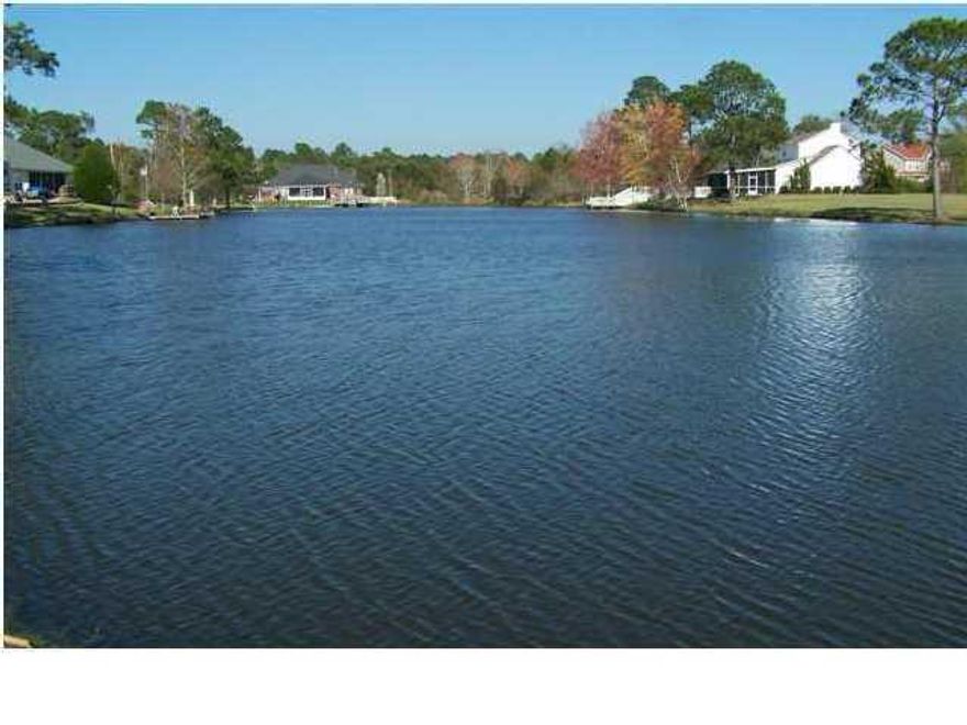 WATER FRONT at $30,000. claiming 154 Front Feet on a beautiful stocked LAKE located in a Bay Front Community known as the ''Casa Grande Estates'', just (3) minutes off Interstate 10, Exit 28 for traval convenience! AFFORDABLE AT $30K-- Purchase now, build your Dream Home when you're ready. Beautiful, cleared lot centrally located on this stocked lake, naming a few fish species: BASS, BRIM, HYBRID BRIM, CRAPPIE, AND CATFISH caught here! Also covered Gazebo for your family's enjoyment right beside the lake. Excellent lot location in the community as well. Quick travel-- (20) minutes East to Crestview, (20) minutes West to Pensacola. Come check this fabulous neighborhood out-- it's a Family oriented community. LOW HOA fees, $225./Year.