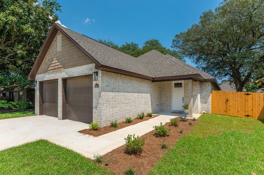 Tucked away on a quiet street in the highly sought after Kenwood neighborhood, you'll find this newly built brick home. Built by D.L. Curtis Construction, this home is so much more than your standard new construction home & features many special custom features & construction upgrades. Offering 4 bedrooms & 3 full bathrooms, one of which is a Jack and Jill style bathroom allowing each bedroom to have access to their own bathroom.  As you enter the front door through the large covered porch, you walk right into the spacious living room with an open concept floor plan that blends your living space & gourmet kitchen into one fabulous area. The living room features crown moulding and there is scratch/water resistant luxury vinyl plank throughout.