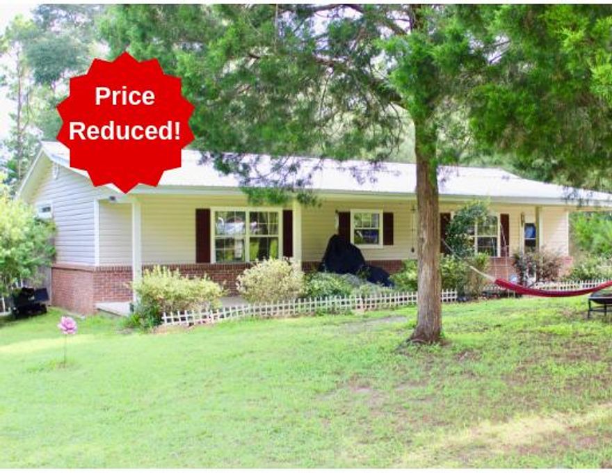 Price Reduced!!! Nice house with a large yard in a quiet neighborhood. This 4 bedroom house was built in 2007 using the existing slab of a 1 bedroom house already on the lot that was built in 1977. The home has a metal roof with vinyl soffit and fascia. The exterior is brick and vinyl siding making it maintenance free. There is a beautiful porch along the entire front of the house (8x52) for you to enjoy the peace and quiet of the country neighborhood. On entering the house you find yourself in a HUGE living area that will make any size family comfortable and be an excellent place for entertaining friends. The kitchen in this home is user friendly. Above ground pool with a deck.