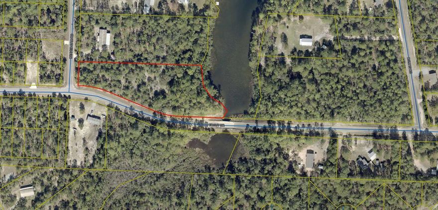 2 acres on Beaver Creek at Mossy Head!  Wooded lot with city water available and electric.  Appx. 245' on the water, subject to an up-to-date survey.