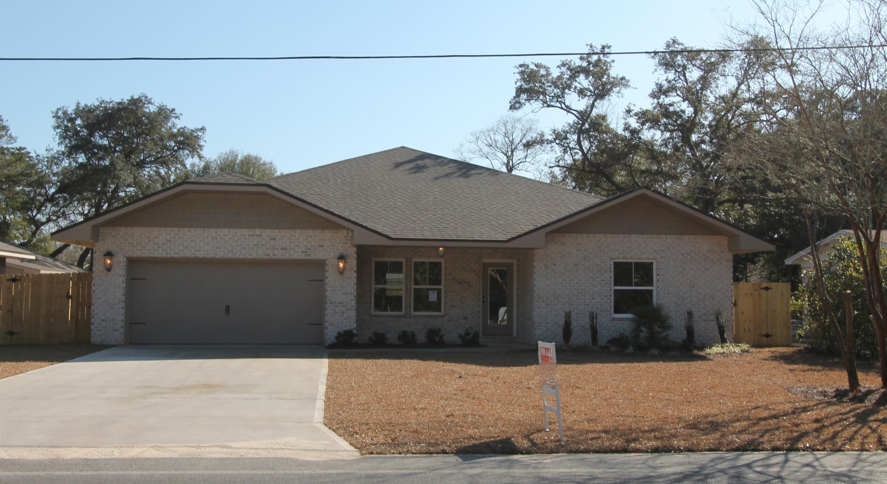 Welcome home!! Awesome new floor plan, offered by a multiple award winning builder and past Parade of Homes winner! Completed in Feb. 2016. Home is on a large lot with beautiful mature trees which is also in a quiet neighborhood with location, location, location. This 4/3 custom brick plan has super curb appeal. There are 10 ft. ceilings w/ impressive crown molding. There is hand scrapped hardwood flooring and and 5 1/4'' baseboard throughout the main living areas. As you approach the front of the home, you will be quite impressed. The covered porch is very welcoming, and the gorgeous leaded glass doors for a grand entrance. The formal dining room is at the right of the home's front. Just past the dining room, you will then enter the chef's delight kitchen which will boast custom maple cabinetry, granite countertops, a wet bar with wine cooler, a large pantry, and and stainless appliances (including an oversized commercial grade frig./freezer). Please see appliance details in photos. At the left of the home's entrance is bedroom one, continuing down the hallway is the guest bath, then bedroom two. The oversized greatroom is in the rear of the home and opens to a covered porch, which is perfect for entertaining. The master suite is oversized, has 2 large walk - in closets, a linen closet, a walk - in shower, a whirlpool garden tub, and a double vanity. The laundry room is at the rear of the kitchen, and has a door which opens to the garage. The yard will be beautifully landscaped and comes complete w/ a well, sprinkler system and timer. Home has a Taexx ''in the wall'' pest control system that is accessed from the exterior of the home for the owner's convenience. The yard will be beautifully landscaped and comes complete w/ a well, sprinkler system, and timer.