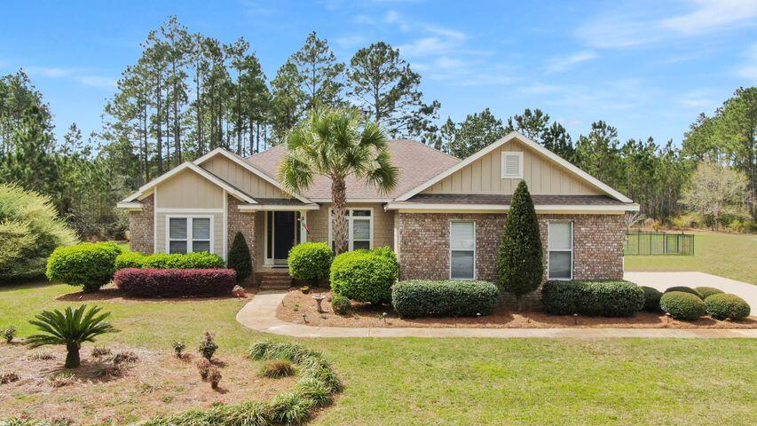 14k Price Drop!!! Attractive and very comfortable, craftsman style 3 bedroom, 2 full bath golf course home. On 3/4 acre parcel in popular/growing Windswept Estates. Located just off State Highway 20. Short drives to Freeport and Destin's world class beaches. Kitchen has granite counters, tall 42 inch cabinetry, chef style gas range, and eating area. Large pantry and good size laundry room. Beautiful flagstone fireplace with cedar mantle. Living area has trayed wood ceiling and opens to a large deck area with hot tub and grill bar. Larger size bedrooms with common LVT flooring. Nicely landscaped front, back, and all around the house with mature trees and shrubs which add privacy. Plenty of room for a pool. Well maintained home with complete interior repaint. New HVAC installed in 2021. Efficient tankless water heater. Security system installed. 3 hole putting green in back yard with fire pit and more!! Community nature and dog walk trail just steps away with benches, pavilion and pond for fishing. Windswept Estates is a 750 acre master planned gated community that offers a top shelf 18 hole golf course, swimming complex, tennis and basketball courts, and a children's playground.