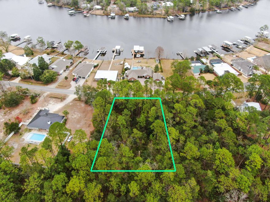 Very nice lot in Bay Grove/Mallet Bayou area. Very few lots left in this popular Freeport neighborhood. Lot, located just across the street from the water is entirely in flood zone ''X''. Close to Hwy 331, 30A, new park and boat ramp. No HOA. Interior lots in this neighborhood very rarely come available. Great opportunity! Boundary survey available (2011). (Please verify any important details, information taken from public records.)