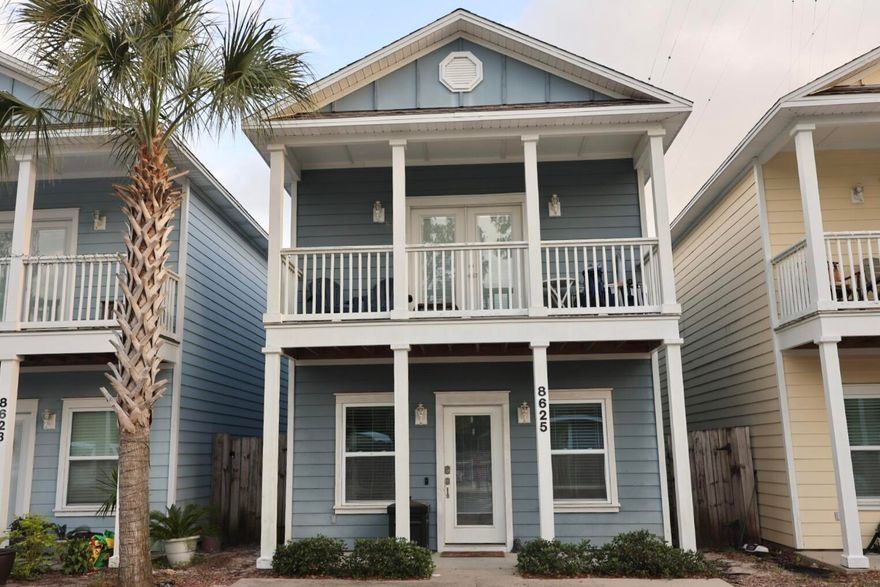 Located just minutes from the beach, shopping, and dining, this beautifully maintained home is in a gated community right across the street from the pool & is a perfect as a private residence or short-term rental. Featuring tall 10-foot ceilings and brand new LVP flooring on the lower level, the home offers a bright, open layout with a furnished living and kitchen area (bedroom furnishings not included). All stainless-steel appliances and washer/dryer. Shaker style wood cabinets and Carara White Marble counters with an island. HOA fees cover pool maintenance, garbage, lawn care and the security gate. The primary bedroom is conveniently located on the lower floor with a private door to the backyard, while upstairs boasts spacious secondary bedrooms perfect for guests or family.