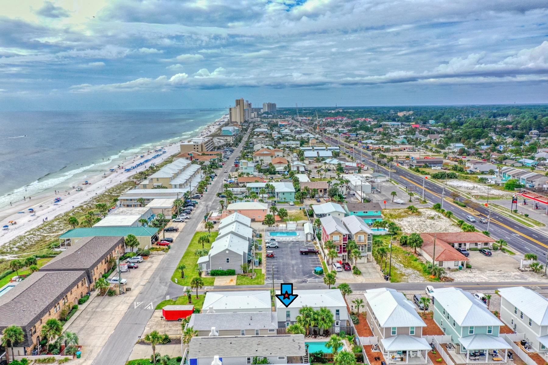 Check out this hidden gem! Located south of Thomas Dr. just steps to the sugary white sand! Imagine pulling right up to your door with no elevators to wait on and with 2 parking spaces you will never have to fuss with fighting for a parking spot! This is a small community of only 20 units. This unit offers a PRIVATE/Keyed beach access and community pool just steps from your front door! This townhome is being sold fully furnished to include the beach cart, storage box, and all the beach toys! The roof, siding, windows and A/C were all replaced post Hurricane Michael. With rental projections of $25,000-$30,000 per year and low HOA fees of only $337.00 per month this is a great investment!