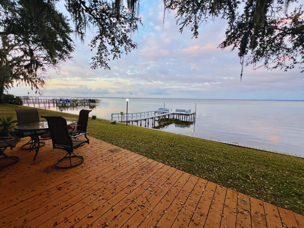 Spectacular Waterfront Townhome with Full Bay Views from the Kitchen, Living Room & Large Master Suite! Waterfront Living Doesn't Get Much Better in This Quaint, Quiet Community of Mossy Cove in the Heart of Destin. With Spectacular Water Views Stretching as Far as the Eye Can See in All Directions You Will Never Want to Leave Your Private Patio as You Sit and Enjoy the Warm Coastal BayBreeze Off the Water. Superb Amenities to Include an Olympic Size Swimming Pool, Boat Dock & Kayak/Paddle Board Launch, Small Boat Ramp and Potential Boat Parking. Recent Upgrades Consist of New Roof in 2021, HVAC in 2022, Hurricane Windows & Exterior Storm Slider 2023. Easily Change this 2 bedroom back to a 3 bedroom; The current Owner Opened the 2 Waterfront Bedrooms into an Expansive Master Suite with A Wall of Windows Overlooking the Bay! Simply Add Back One Wall if Desired. Inside you will find this adorable townhome very spacious with Lots of Natural Light in the Living Room & Kitchen. 3 Full Bathrooms & Laundry Closet for Convenience, 2 Separate Living Areas or Turn One into a Roomy Office. Being Sold Unfurnished, However Some Furnishings May Be Negotiable. Don't Miss Your Chance To Jump On This Unique Waterfront Property And Start Living Your Dream Life on the Destin Bay Today!
