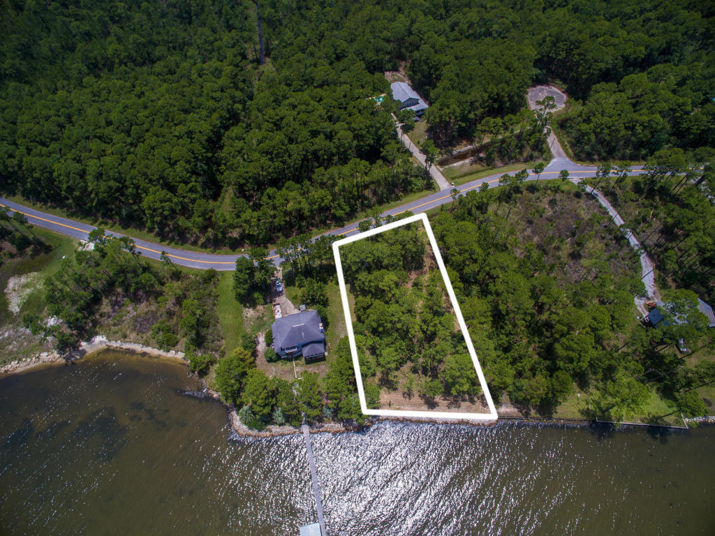110 feet on the bay! Build your dream home on this beautiful waterfront lot located on a secluded quiet cul-de-sac minutes from the 30A beaches as well as the shopping and activities at Grand Boulevard. Enjoy gorgeous sunsets over Choctawhatchee Bay. Seawall in place as well as DEP permits to build the perfect dock for your boat.