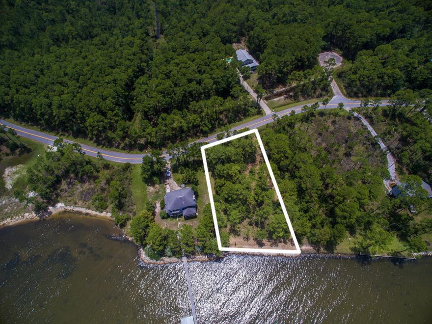 110 feet on the bay! Build your dream home on this beautiful waterfront lot located on a secluded quiet cul-de-sac minutes from the 30A beaches as well as the shopping and activities at Grand Boulevard. Enjoy gorgeous sunsets over Choctawhatchee Bay. Seawall in place as well as DEP permits to build the perfect dock for your boat.
