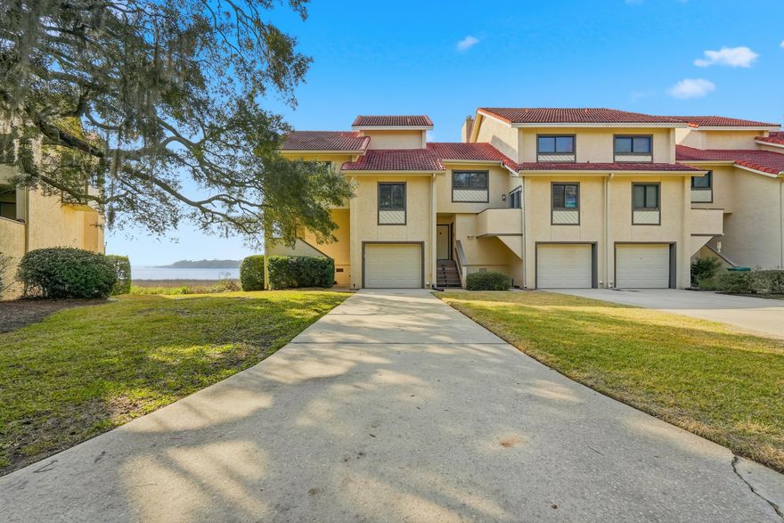 Stunning waterfront townhome in the heart of Bluewater Bay, offering breathtaking views of the Choctahatchee Bay and an effortless coastal lifestyle. This beautifully renovated three-bedroom, three-and-a-half-bath residence features modern finishes throughout and outdoor living spaces perfectly positioned to take in the water views.Step inside to a fresh, bright, and airy interior highlighted by luxury vinyl plank flooring, updated lighting, and a cozy wood-burning fireplace anchoring the main living space. The open kitchen is designed to impress with stone countertops, designer backsplash, crisp white cabinetry, stainless steel appliances, and a dedicated dining area. A comfortable sitting room just off the kitchen and living area creates additional space to relax or entertain while enjoying the scenery. Upstairs, carpeted stairs and bedrooms lead to a second-floor loft on the landing with vaulted ceilings, offering flexible space for a home office or reading nook. The primary suite is a true retreat with vaulted ceilings, stunning bay views, sleek countertop in en suite, a large vanity, bath-shower combo, and a walk-in closet. An additional bedroom is thoughtfully designed, including a third full bath with a convenient walk-in shower and upgraded carpet. Additional highlights include a single-car garage, abundant storage, washer and dryer included, and a long driveway for extra parking. The HOA provides lawn care and pest control, allowing for low-maintenance living. Ideally located within walking distance to the marina, this waterfront townhome offers the perfect blend of comfort, style, and coastal convenience!