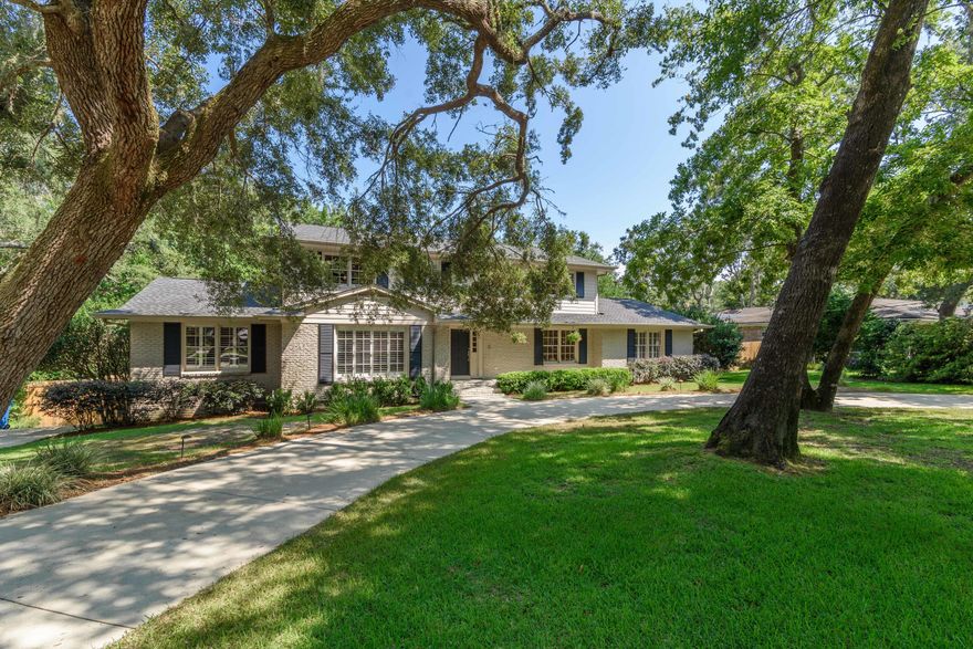 Located in the heart of Gulf Breeze Proper in the established neighborhood of Northcliffe, this stately home offers lush mature landscaping with majestic Oaks, gunite pool, gorgeous kitchen with an open spacious floor plan and two living spaces. You'll enjoy the stunning hardwood floors throughout the main living space and a spacious dining area suitable for a table with service for 10. The second living space has a fireplace, walk-in closet and exterior door to the pool. Just off the living space is a bedroom with a full bathroom. There is an additional bedroom or library off the living area and a bonus space that would make for a prefect office. This entire wing makes a perfect In-Law suite. The kitchen comes equipped with unique granite counter tops, custom cabinetry with soft close dra Located in the heart of Gulf Breeze Proper in the established neighborhood of Northcliffe, this stately home offers lush mature landscaping with majestic Oaks, gunite pool, gorgeous kitchen with an open spacious floor plan and two living spaces. You'll enjoy the stunning hardwood floors throughout the main living space and a spacious dining area suitable for a table with service for 10. The second living space has a fireplace, walk-in closet and exterior door to the pool. Just off the living space is a bedroom with an en-suite bathroom. There is an additional bedroom or library off the living area and a bonus space that would make for a prefect office. This entire wing makes a perfect In-Law suite. The kitchen comes equipped with unique granite counter tops, custom cabinetry with soft close drawers and abundant storage, gas stove with dual ovens, under cabinet lighting and large island with a prep sink. The primary suite is located on the second floor with 2 additional bedrooms and full bathroom. The enormous primary suite has an additional designated sitting area suitable for a desk or Peloton. The bathroom has a double granite vanity with 2 walk-in closets and additional custom cabinets for closet space. The custom shower has dual shower heads and a bench with beautiful mosaic accents and flooring. The exterior has wonderful landscape lighting with a circular drive, side parking pad with a double gate ideal for boat storage. The expansive back yard offers a pool with a tiled open lanai and a playground. Located just half a mile to Gulf Breeze Elementary, Middle and High School, 3 miles to Pensacola Beach and 6 miles to Downtown Pensacola. This location cannot be beat. Check out our full video tour on the MLS and YouTube.