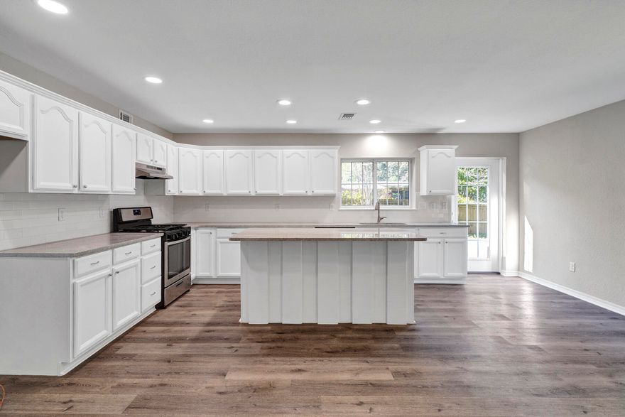 Location and perfection! How would you like Ferry Park right over your back fence? Large kitchen has new granite countertops, tile backsplash, new stainless appliances, and a huge island! Your island has the same beautiful board and batten as the fireplace you'll be looking at while you cook! New LVP flooring and paint throughout. The one car garage is actually heated and cooled, with the laundry room right inside of it. New full sized Samsung 'champagne stackable washer and dryer'' conveys. New decking under the metal roof to take place before closing. The large screened front porch is the perfect place for rocking chairs, a sofa, and a swing! There is just too much to say about this one. Gems like these don't come along often! Buyer to verify all measurements.