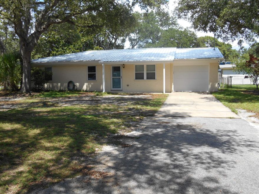 Renovated well maintained cement block home on a corner lot conveniently located in Shalimar, close to Eglin, Hurlburt, and the Beach.  Home was completely rewired in 2018, new metal roof in 2021, screened patio, Mini split A/C for the garage, A/C air handler new May 2025, new windows throughout with transferrable warranty in 2022, tile shower in Master Bath, new doors, interior trim, exterior trim and gutters. newer water heater, Kitchen features Stainless Steel appliances and granite/quartz (?) countertops.Multiple offers received,  Highest and best by noon on 6/26.