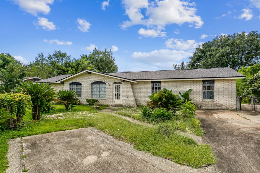 Perfect home to make it your own or a great investment property! Brick home with hurricane protection and a new roof! Enjoy the backyard with planted banana, orange and bamboo trees. The additions made to this home gives you an amazing opportunity to be creative with all of your space!  There are two living rooms, a dining room AND spend some extra time with your hobbies or business in the large bonus room!  Convenient location and a quick drive to the interstate, hospitals, and entertainment!