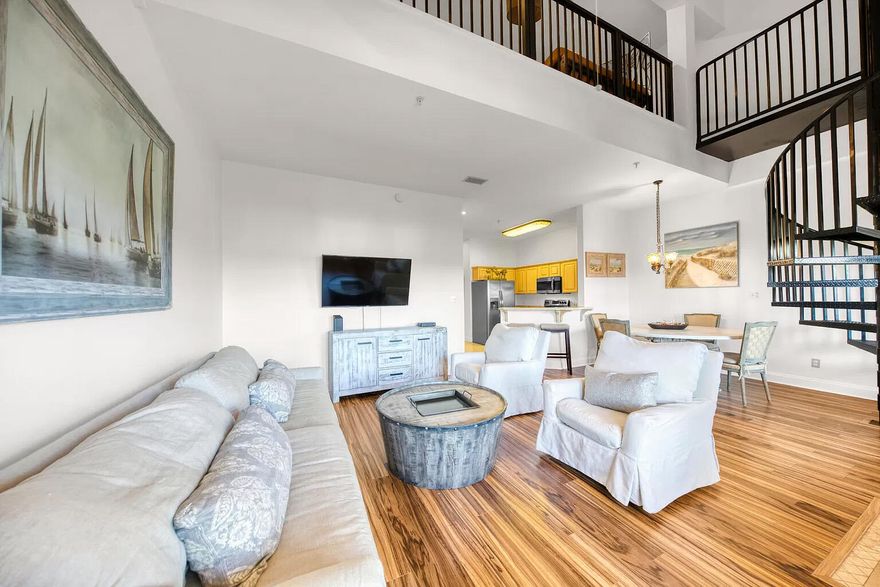 If you are someone who likes to be in the middle of what's happening, then you are going to love this condo! This condo is all about convenience and location and is located in The Plaza of Destin, a low-rise building with mixed retail on the lower level. This condo is super convenient to Destin Commons, Whole Foods, the Legendary Marina, lots of restaurants, and of course our beautiful beaches! This condo has a showstopping entrance with high ceilings, open floor plan, and spiral staircase. There are 2 master suites - one upstairs and one downstairs. There is also a bonus bunk room upstairs that works great for weekend guests. Condo is turnkey and fully furnished. No shortage of parking exists here at this condo building.