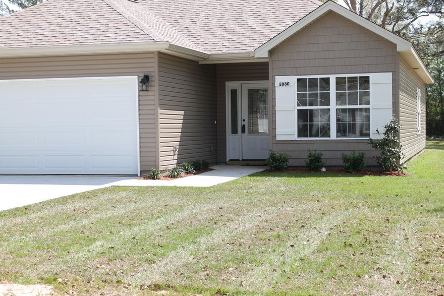 Wow a new custom home by LSM Builders! This one has just been completed! The centrally located larger home site is on almost a 1/2 acre with pecan trees and a level lot. New Home 3 bedroom 2 bath home! 2 car garage,large windows for lots of sun light, Oil-rubbed Bronze faucets, Custom lighting throughout, tile, and newly paved road! Room dimensions are approximate.