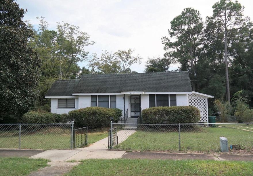 This is a great opportunity to live just a few blocks from the beautiful Lake DeFuniak. The home is 1952 sf (4330 total under roof).The home has 3 bedrooms, 2 full baths, family room, office/den, spacious kitchen, formal dining room, beautiful hardwood floors, central H&A. There is also a large basement that has a laundry area, access from stairs inside and also ground entry at back of the home. The home sits on 1/2 acre with a circle drive and carport in the back. There is also a 3rd full bath at the back of carport for easy access while working in the yard or basement. All measurements must be verified by Buyer. It will need a little TLC. Cash or Conventional financing only.
