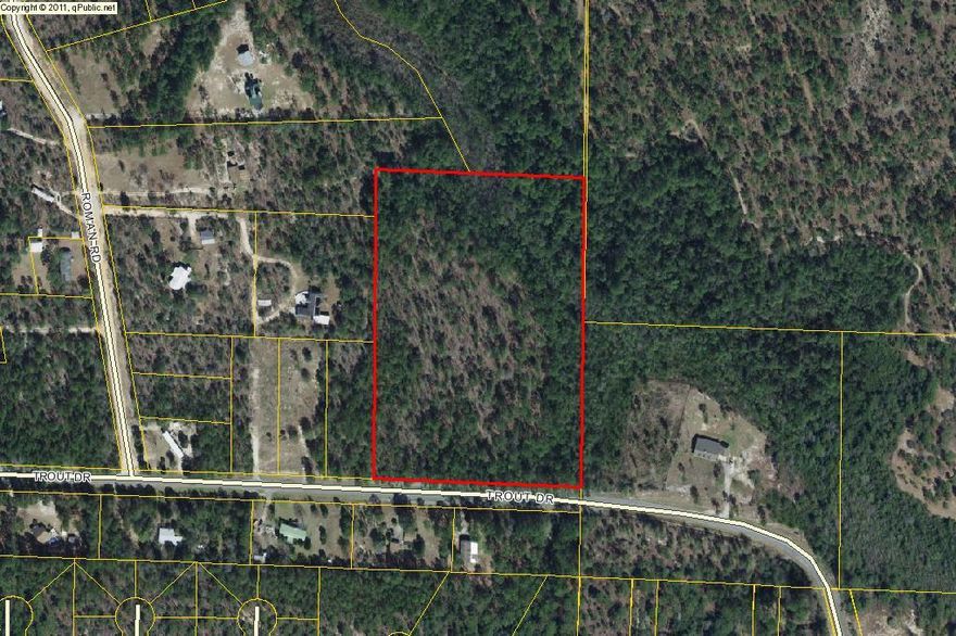 Fantastic 10 Acre Tract on paved street! This one won't last long! This property is close to town and partially wooded. Electricity and water are available but tap fees have not been paid. There is a small stream on the very back of the property (per seller). This would make a perfect place for your dream home! Mobile homes and horses are allowed here! Don't miss out, call for your tour today!