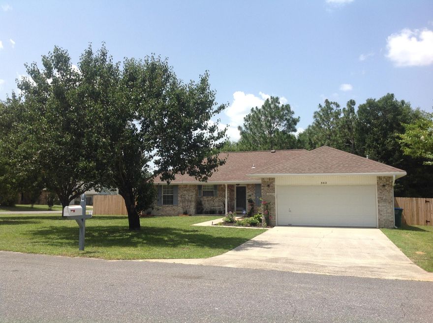 Your search is over! All brick beauty located on one of the largest corner lots. Beautiful front gardens with seating area. The foyer welcomes you into the spacious, open floor plan with Cathedral ceiling in Great room, complete with gas fireplace and wood mantle. Tiled eat-in Kitchen features breakfast bar, stainless steel 5 burner GAS stove with convection oven, stainless steel microwave FULLY Vented through the ceiling, dishwasher, island, large corner pantry, and deep stainless steel sink with newer sensory touch faucet. Carpet and Pergo wood flooring is less a year old, and tile in wet areas makes cleaning a breeze. Large Master suite features a huge master bath with dual vanities and 2 walk in closets! Laundry room has a sunny window. AC has smart phone capabilities. Yard is