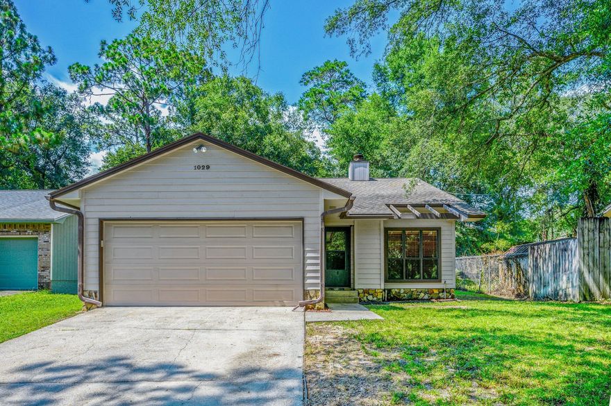 Impeccably maintained and incredibly clean centrally located Niceville home.  Living large, this 3 bedroom 2 bath home feels spacious and inviting.  Cozy fireplace, hard floors, and newer kitchen-including neutral countertops, tiled backsplash and newer appliances.  Bring the pets, NO CARPET! The home completes with tile and wood look laminate throughout.  Garage features pull-down stairs and bonus attic storage with additional plywood.  Large yard for entertaining.  Sellers have updated the terrace with modern block, creating an inviting backyard space!  Mature trees, easy commute, this home is perfect!!