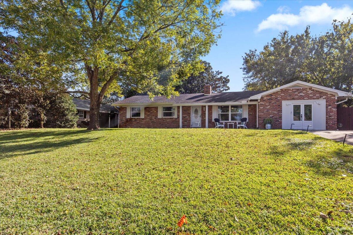 A captivating, thoughtfully remodeled 4BR/3BA home nestled in the heart of Fort Walton Beach within the well-established Colony Estates community with a NEIGHBORHOOD PARK AND BOAT RAMP....all with NO HOA!!!   .  This all brick, exceptionally maintained residence offers 2,671 sq/ft of smartly designed space with plenty of room for everyone to have their own place to relax, work, play, and entertain!  Offering 2 living spaces with woodburning fireplaces, a gorgeous kitchen with granite counter tops, tile backsplash, newer appliances, a dine-in kitchen area that opens to the outdoor space. The generous sized primary bedroom suite is located off the family room and provides an open and relaxing area along with a walk-in closet, providing ample access  and shelving for all your personal effects and a double sink vanity and tiled shower with rain shower head in the bath. The other guest bedrooms are located on the front side of the home.   2 of the guest bedrooms share a bath, while the 3rd guest bedroom has a ensuite bath.  A large flex/laundry room with a separate entrance and lots of storage space and the oversized covered porch with a built-in counter and TV mount perfect for Florida living completes the footprint of the home.  The backyard has a newer fence that has been painted with marine grade stain, 2 large sheds that convey "as is" and even has a peek-a-boo window for furbabies!   A few other features are tile floors in all areas except 3 guest bedrooms and connecting hall (enough extra tile is being conveyed with sale to tile all the bedrooms/hall), all new high impact windows, new high impact sliding doors, updated electrical panel, overhead service, and code compliant grounding system, updated baths, freshly painted - See Home Improvements List for all improvements.   This home is a rare find that you don't want to miss out on --- it could be the one!  It lives LARGER THAN IT LOOKS! 
Buyer is responsible for verifying all data and information including lot size and room measurements as it is deemed to be reliable but not guaranteed.   
