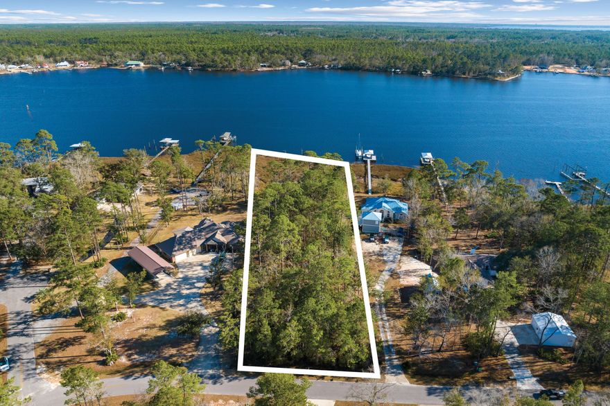 Discover the tranquility of waterfront living in Lagrange Shores, where a rare opportunity awaits on more than one acre of bayou-front property. This 1.3+-acre lot, with .72 acres of uplands, offers a peaceful retreat in a rural setting known for its scenic bay waters and towering oak trees. With no HOA, this property presents a blank canvas for those dreaming of a waterfront lifestyle. Located close to the new Freeport Middle School, set to open in August 2024, and the Freeport Regional Sports Complex, the property combines the allure of secluded living with the convenience of nearby amenities. A short drive takes you to Freeport's Publix, shopping, dining areas, and the renowned white sand beaches and unique charm of South Walton County and 30A.  Boating enthusiasts will appreciate the scenic boat ride options to Destin Pass or Panama City via Choctawhatchee Bay and ICW. Away from the crowds and traffic, this property offers a peaceful escape while still being connected to the vibrant community. As Freeport continues to grow, waterfront homes in this neighborhood have consistently sold over $1 million. This property, which includes a survey and completed wetlands study, represents an exceptional opportunity to build your dream home in a fast-appreciating area. Embrace the chance to make your waterfront dreams a reality in Lagrange Shores.