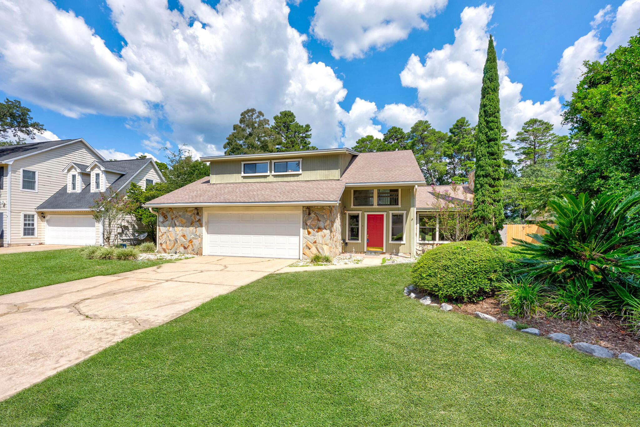 Welcome to this 4-bedroom, 3.5-bathroom home that is 2,130 sqft on 0.41 acres! With a gorgeous pool, spacious backyard, and stunning living space, this home is a Niceville gem! As you step through the grand entrance, you're greeted by cathedral ceilings that extend to the second floor and large windows lining the front of the house, allowing an abundance of natural light. A cozy fireplace is in the center of the living room, making it perfect for family gatherings or quiet evenings. The living room leads seamlessly into the kitchen, complete with a breakfast nook, stainless steel appliances, and double doors leading directly to the pool deck. For more formal occasions, the separate dining room provides the ideal setting for dinner parties or holiday celebrations. The luxurious first-floor primary suite is a true retreat, featuring a spa-like en-suite bathroom with double vanities, a soaking tub, and a separate walk-in shower. The Primary also had double doors that allow you private access to the pool! Upstairs, a spacious flex space on the landing offers endless possibilitieswhether you're looking for a home office, gym, or play area, this space adapts to your lifestyle. With 3 additional bedrooms upstairs and 2 full bathrooms, there is plenty of room for family and guests. Wanting an upstairs Primary as well? One of the bedrooms does have an ensuite bathroom and walk-in closet! The home's thoughtful layout and modern amenities make it the perfect blend of luxury and functionality. Situated in the Woodlands neighborhood, this property is just moments away from local schools, parks, and shopping, offering convenience and comfort in one exceptional package.