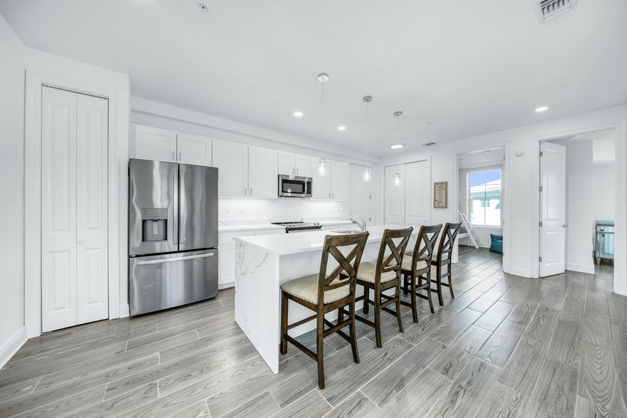 Brand New Condo in Gulf Place Residences!  Beautiful end-unit featuring wrap-around balcony with gulf-view overlooking the amphitheater. 3BR (one is a bunk room), 2 BA, with all of your must-have features - open floorplan, 9' ceilings, Quartz countertops, waterfall kitchen island, stainless appliances, pantry, elevator, recessed lighting, and wood-look tile flooring.  Ideal location with 3 deeded beach accesses, community pools, tennis, dining (Shunk Gulley, Perfect Pig, Pizza by the Sea, Growler Garage, Sunrise Coffee, Pecan Jack's Ice Cream), and boutique shopping. Ph 2 amenities in Gulf Place Residences will include private pool and fitness center. Additional items available for purchase include furnishings, deeded covered parking space, and storage unit - call today for details!