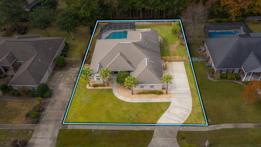 Incredible new listing in Bayshore Place. This all brick home has 4 bedrooms and 3 full baths. There is a whirlpool tub in both the master bedroom and the back full bathroom. Home features two living areas, large kitchen with pantry, solid surface countertops, maple cabinets. crown molding almost everywhere, and wood floors in master bedroom, formal dining room, formal living room and hallway. Out back is a 15,000 gal. saltwater gunite in-ground pool. Pool pump upgraded to energy efficient two speed pump in 2019. Home updated with Smart LED lighting controlled by your cell phone. Custom cabinets with granite counter tops and custom pull outs in the Laundry room. Pool is completely screened with over 450 sq. ft. of screened-in porch area. In the garage are many custom built in cabinets and work bench.
Garage is extra large with about 500 sq. ft. Home backs up to the protected nature area, which makes this home very private. Call today to view this lovely home.