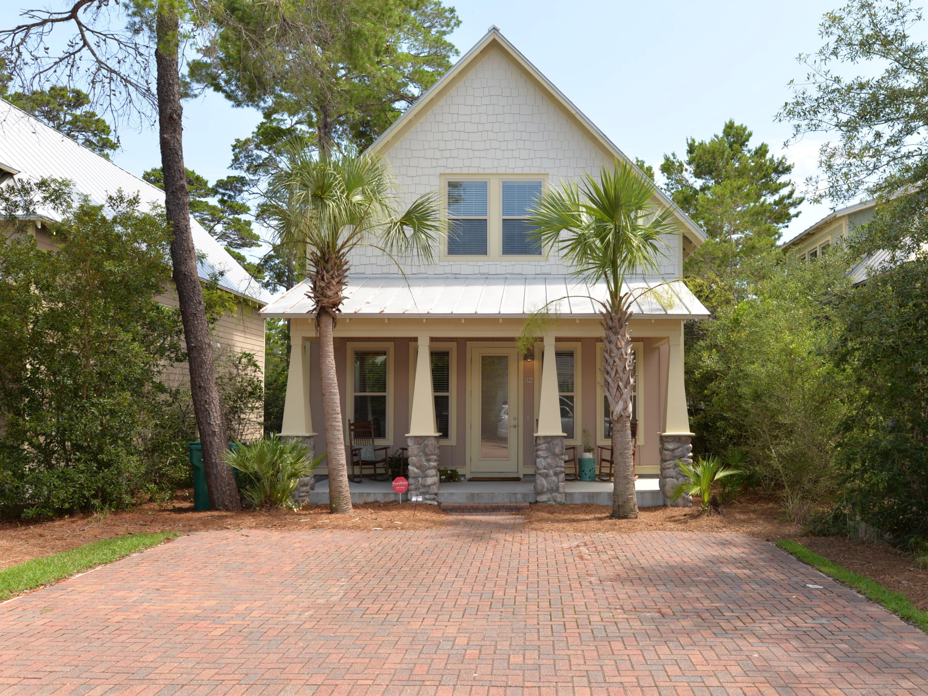 COZY BEACH BUNGALOW! Located in the Cottages of Santa Rosa Beach just a short walk from the beach (Ed Walline Beach Access) & the many attractions of Gulf Place including shops, restaurants, & concerts. The inviting front porch welcomes owners & guests as they enter this four bedroom, three & a bath beach cottage. The open floor plan sports plenty of windows providing lots of light for your ''happy place.'' The downstairs features a living/dining room area, a beautiful kitchen with granite counter tops, stainless steel appliances, a pantry, & a breakfast bar as well as a powder room & master suite. The master suite includes a luxury bath & walk-in closet. There is also a back patio where you can enjoy your morning coffee. Upstairs there are three bedrooms, two baths, & a recreation