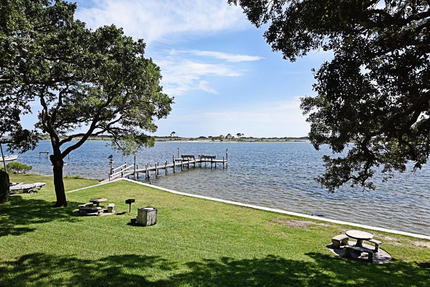 Located on the Sound, near shopping & restaurants, this complex is perfect for no-maintenance, easy, waterfront living! Swimming with a view? Lovely in-ground community pool overlooks the Sound. This unit's balcony looks out over a beautiful courtyard-area shaded by mature oak trees. Elevators at each end of the complex allow for easy access to this 2nd floor unit. Complex also offers convenience of an on-site laundry facility. Freshly painted, with updated flooring and bathroom, this unit is a must see! Perfect for military, civilian or investor. Schedule a showing today!