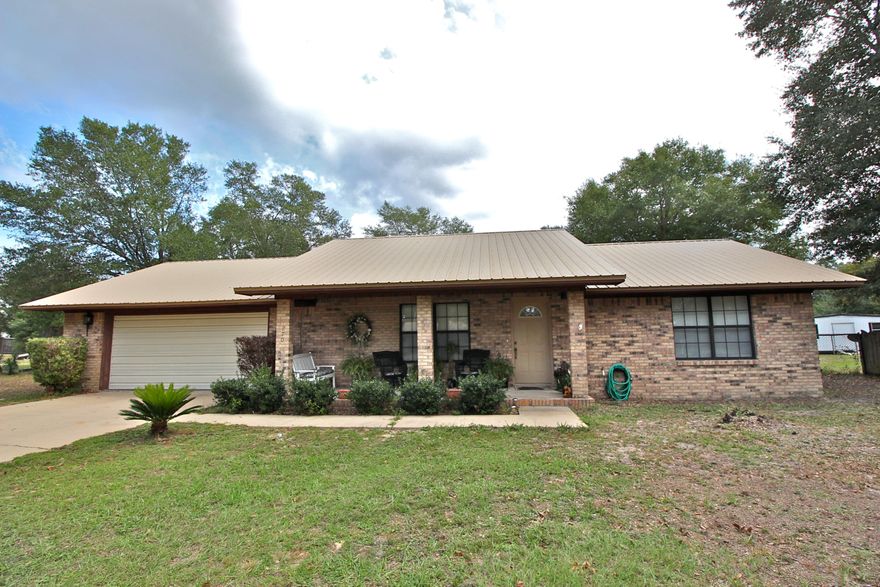 Perfect starter home or if you're downsizing, this 2 bed 1.5 bath home is in excellent condition in a well established neighborhood in town, sitting on nearly half an acre. Rooms are large and comfortable, with laminate floors. Kitchen and dining area have lots of windows and are open to the living room, so you don't feel isolated from the family. They don't build garages like this anymore - it actually fits two cars! And the utility room has far more space than just for laundry...whether storage, crafts or whatever you can imagine, this large space with 2 windows is both functional and it makes laundry more appealing! The huge fenced back yard with open patio and oak trees for shade is a blank slate for you to create whatever you like. $4000 in seller incentives with full price offer!