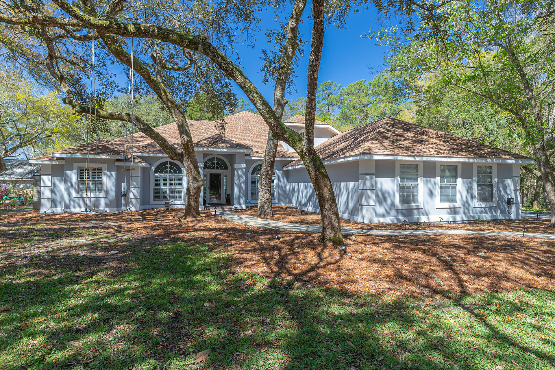 This is the one! Tucked away on a private driveway in the sought after neighborhood of Huntington in Rocky Bayou, this GORGEOUS two-story home boasts over 3,400 sq ft, with 5 bedrooms and 4 bathrooms! The open and inviting floor plan welcomes you with high ceilings, LVP floors, updated lighting, and a grand living room with gas fireplace. The bright kitchen features plenty of prep space, an island, pantry, and an attached breakfast nook overlooking the sparkling pool in the backyard.Spacious primary bedroom with a luxurious walk-in closet; en-suite bathroom with double vanities, jetted tub, and separate shower. Upstairs you'll find a large space that could double as a second master suite, or an amazing game/media room. Spend your summers lounging by the pool and entertaining in