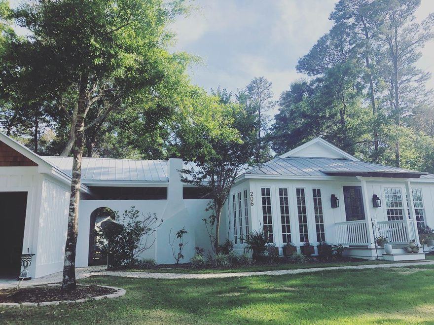 Located within a half mile of the historic Eden Gardens and boat launch, here is your chance to own in beautiful Point Washington. This home features three good-sized bedrooms, two full bathrooms, an office, laundry, large Master walk-in closet, and an open living, dining and kitchen concept. 8ft doors, shiplap, and wainscoting are some of the elevated details noted throughout. This home is designed for the outdoor entertainer with double French doors opening onto a large paver patio. An outdoor living area complete with fireplace and a large outdoor kitchen with sink, stovetop, and RCS grill complete this ideal outdoor space. From the patio, look out on the spacious back yard (large enough to add a pool, quote and design photos available) and chicken coop at the rear of the lot.