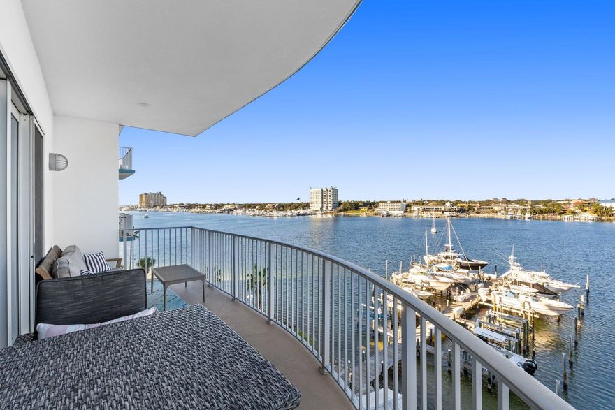 Premier Harbor-Front Condo with Private Beach Access and Luxury Amenities. Experience the pinnacle of coastal living in this 5th-floor, 2-bedroom, 2-bathroom condo at the prestigious Harbor Lights gated community on the Destin Harbor. Boasting 1,390 square feet, this unit offers one of the larger and more thoughtfully designed 2-bedroom floor plans in Destin. Equipped with breathtaking views and modern updates, soak in the sweeping views of Destin Harbor, the Gulf, and the pass from your private balcony. This unit is meticulously updated featuring a beautiful kitchen with custom cabinets, a stylish glass-and-stone backsplash, granite countertops, a single-basin stainless steel sink, and dimmable under-cabinet lighting. Each bathroom is outfitted with designer lighting and elegant finishes. 4" Plantation shutters are found in both bedrooms and the kitchen. Other features include Crown molding in the master suite and living room along with 72" six-speed ceiling fans. As well as LED recessed lighting and a Guardian in-duct air purifier that ensures clean, fresh air throughout the home. 

Harbor Lights offers a boutique, low-density living experience with premium amenities including A resort-style pool with harbor views, A fitness center, wet and dry saunas, and a fenced-in dog park. Amenities also include An owner's clubroom with pool tables, foosball, and a grill area, Kayak and paddle-board storage, and a secure lobby entrance with cameras and elevators. 

This non-short-term rental community ensures a tranquil and private environment. Enjoy seasonal fireworks, dolphin sightings, the Christmas Boat Parade, and stunning sunsets from your own private balcony. For dining and nightlife, the Destin Water Taxi is at your service, or explore the nearby gated Holiday Isle beach access. Harbor Lights is more than a homeit's a lifestyle. Schedule your private showing today to see why this is Destin living at its finest!